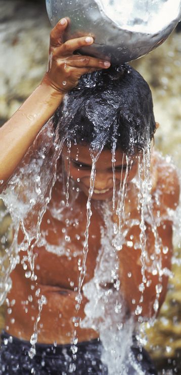 © Pcphotography69 | Dreamstime.com - Brazilian Boy Taking A Shower In Amazonia. Photo